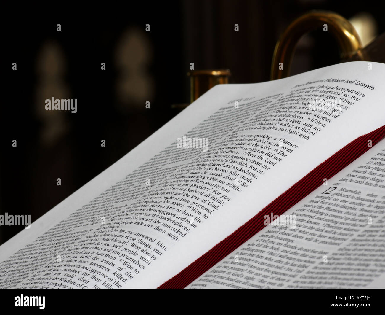 A picture of an open Bible ready to be read from in a English Church. Stock Photo