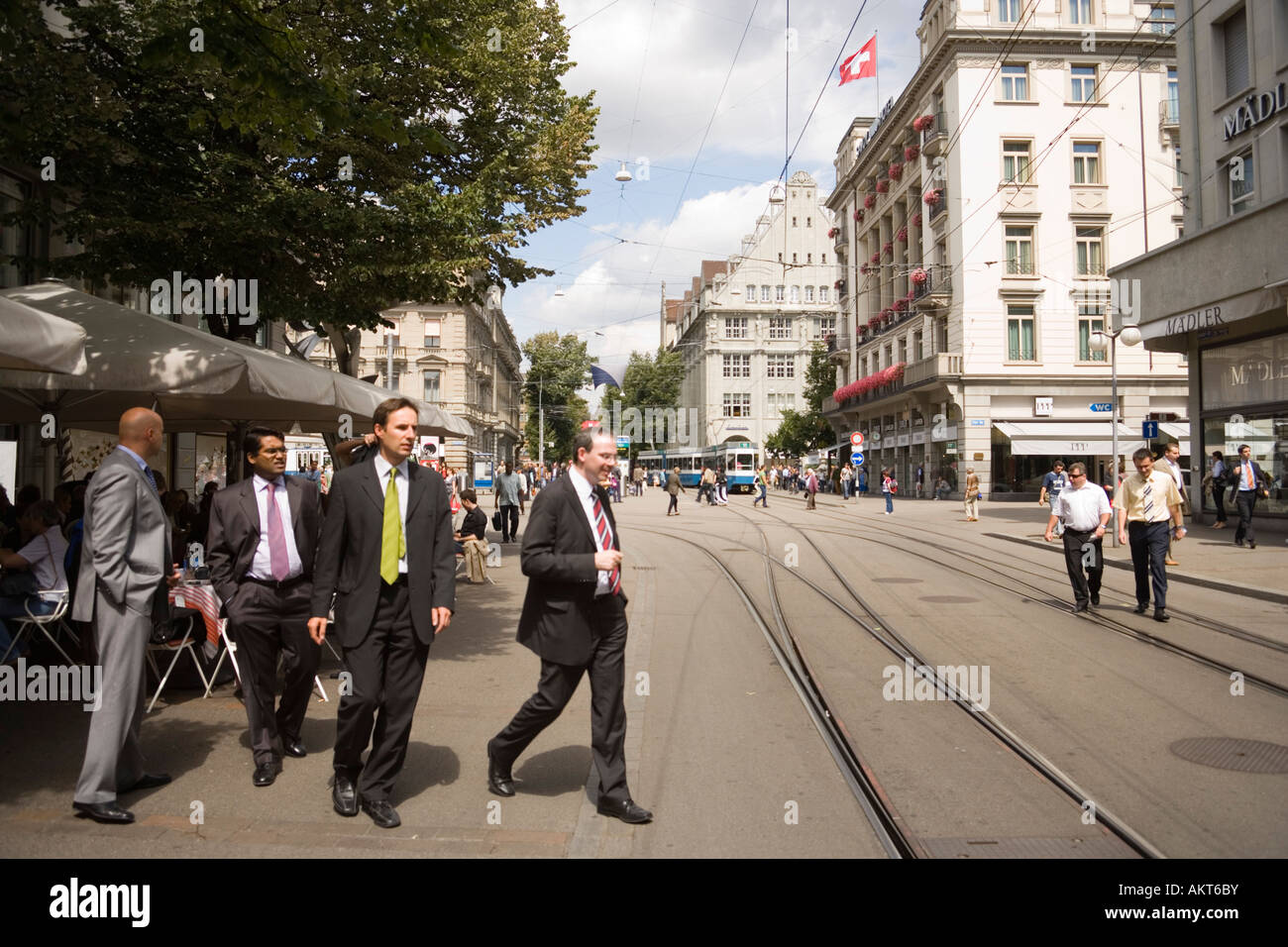 Group of businessmen passing Bahnhofstrasse most expensive real estate