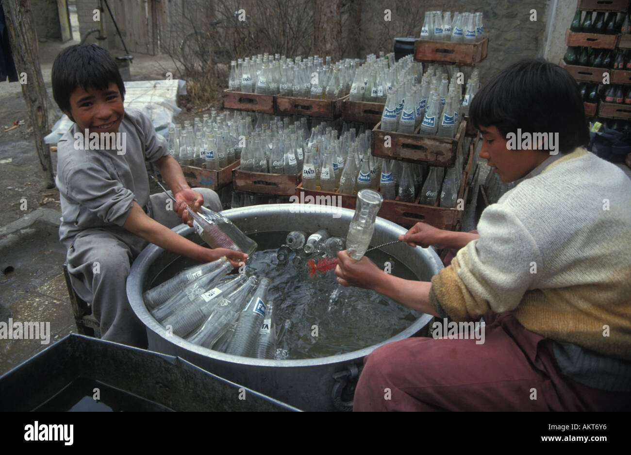 Coca Cola factory boys rinsing bottles West Kabul Afghanistan Stock Photo