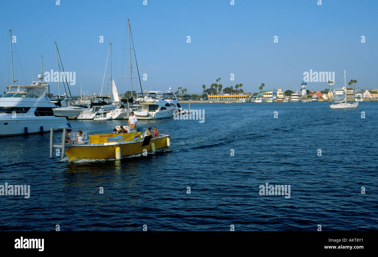 A water taxi takes passengers across the main channel of the marina in Marina del rey Stock Photo