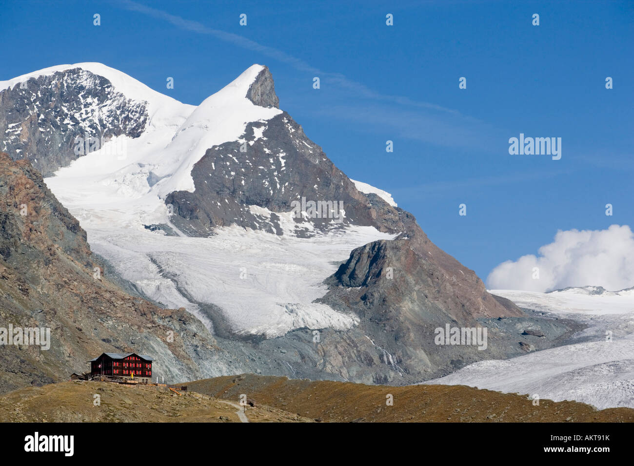 View to the Alpine hut Fluhalp with snowy Alps in background Zermatt Valais Switzerland Stock Photo