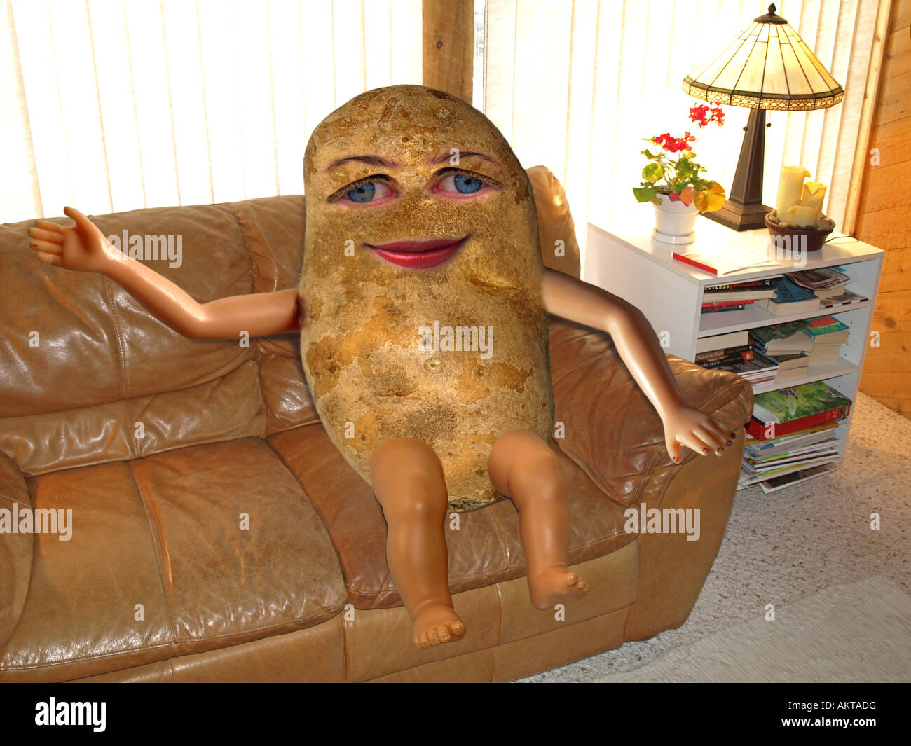 A couch potato relaxes on his sofa while waiting to do nothing the rest of the day Stock Photo