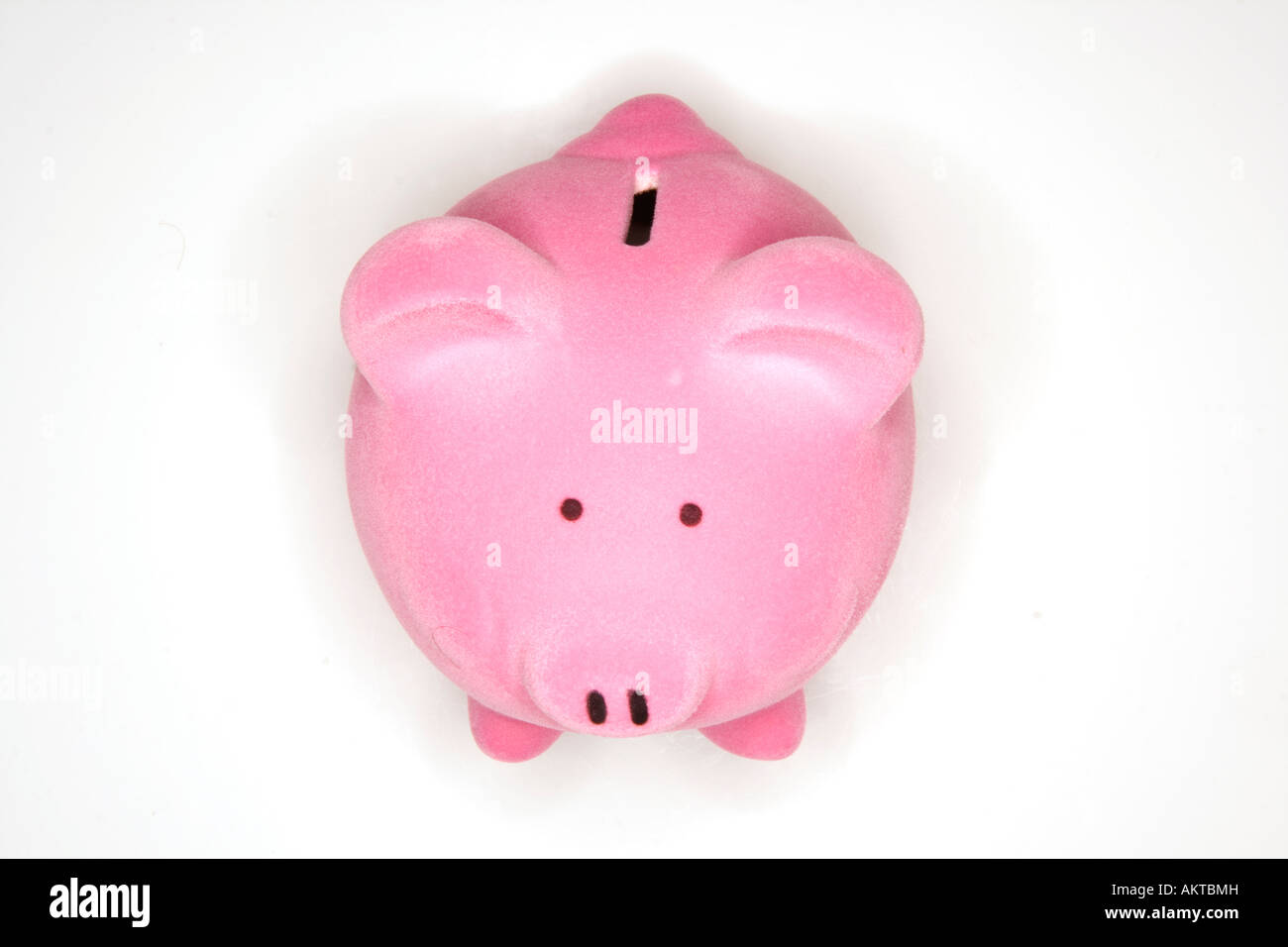 Pink piggy bank isolated on a white studio background Stock Photo - Alamy