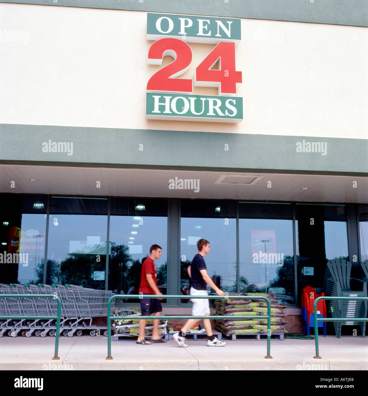 Sobeys supermarket Open 24 Hours sign and young men at the entrance Stock  Photo - Alamy