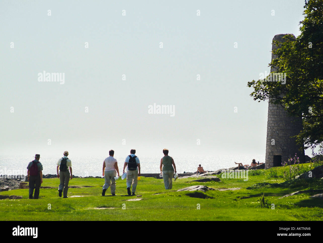Walkers at Jenny Brown's Point near Silverdale Lancashire Stock Photo