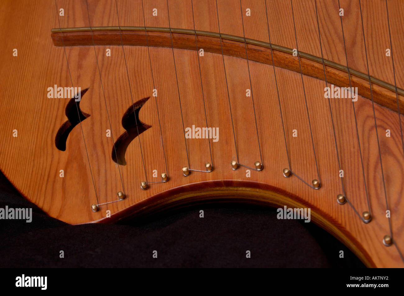 Abstract of a handcarved wood pentatonic lyre Stock Photo