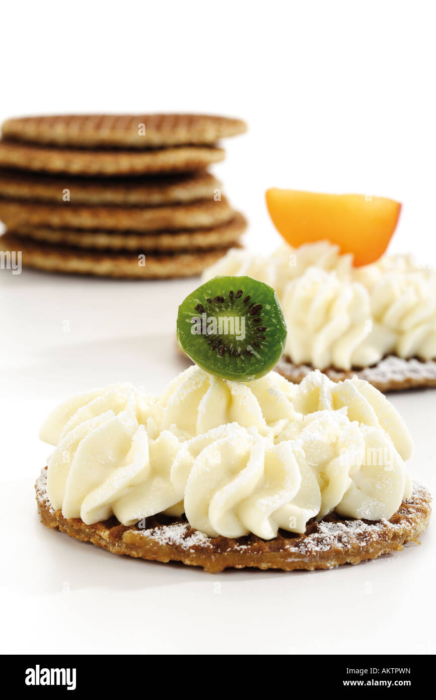 Caramel waffles with cream cheese and fruits, close-up Stock Photo