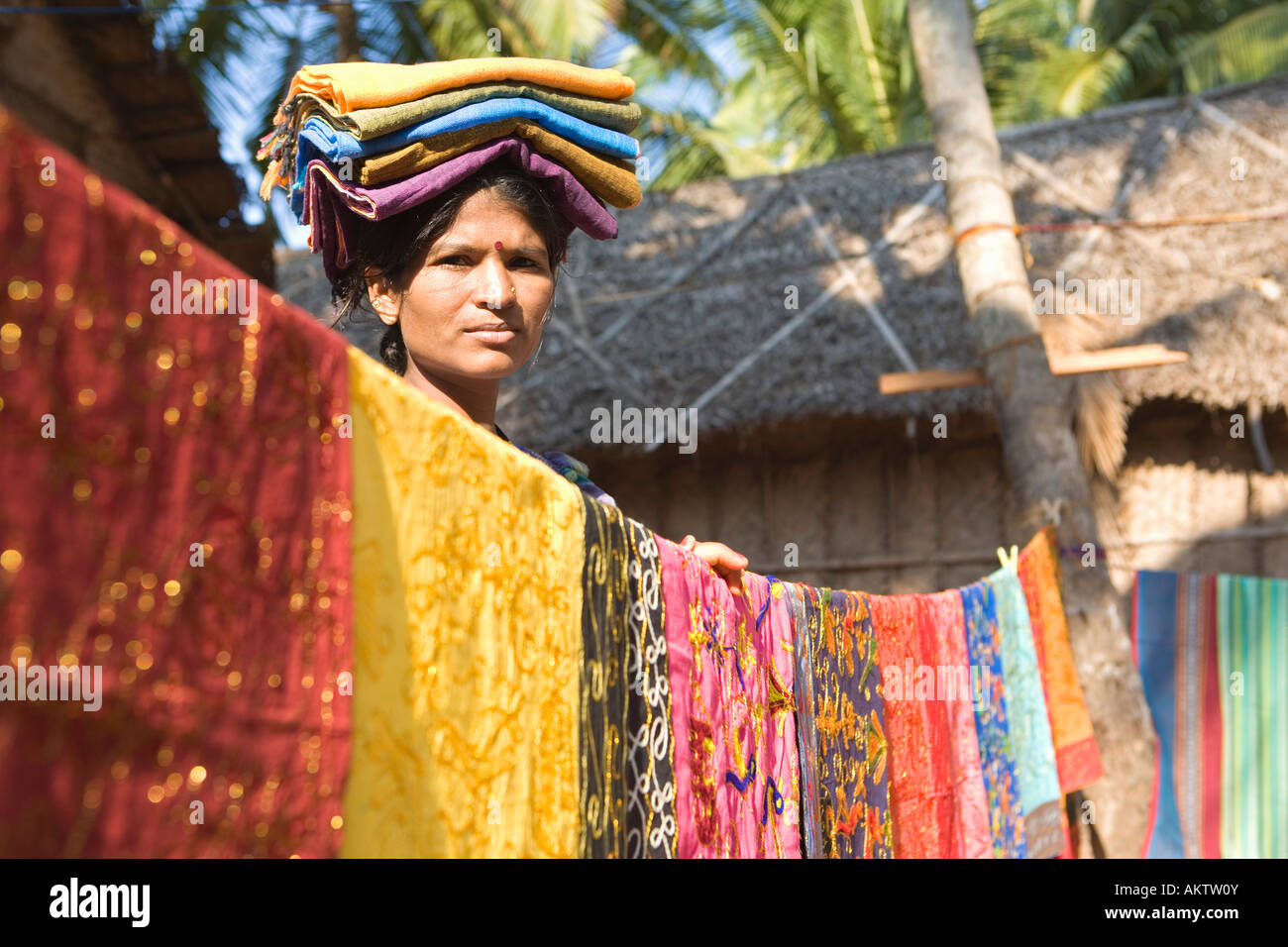 INDIA KERALA VARKALA WOMAN WITH HER FABRICS READY FOR SALE Stock Photo