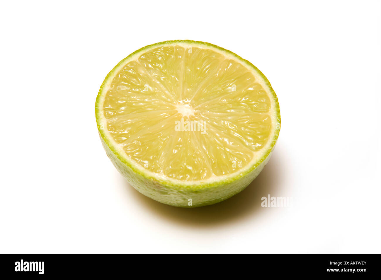 Lime halved on a white studio background Stock Photo
