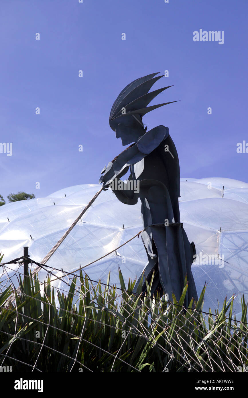 Metallic human sculpture with Biomes behind at the Eden Project