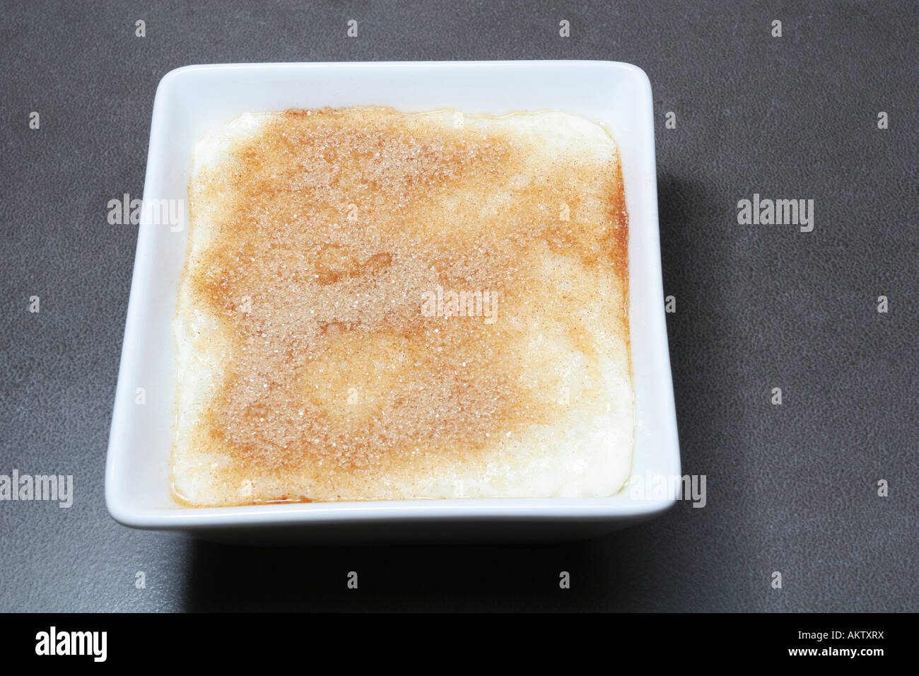 hot rice pudding with cinnamon sugar in a square bowl Stock Photo - Alamy