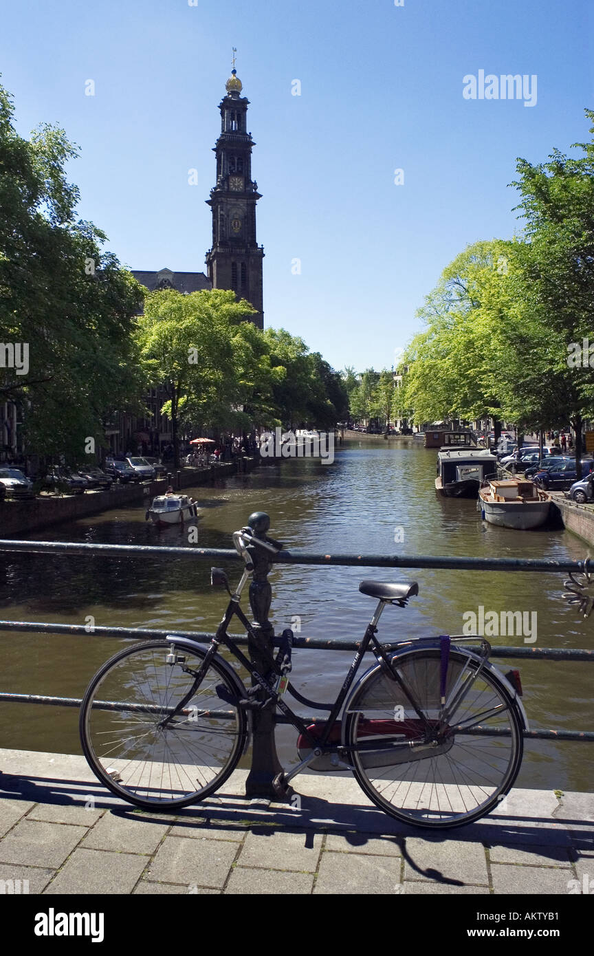 Bicyle leaning against railing on a bridge in Amsterdam Stock Photo