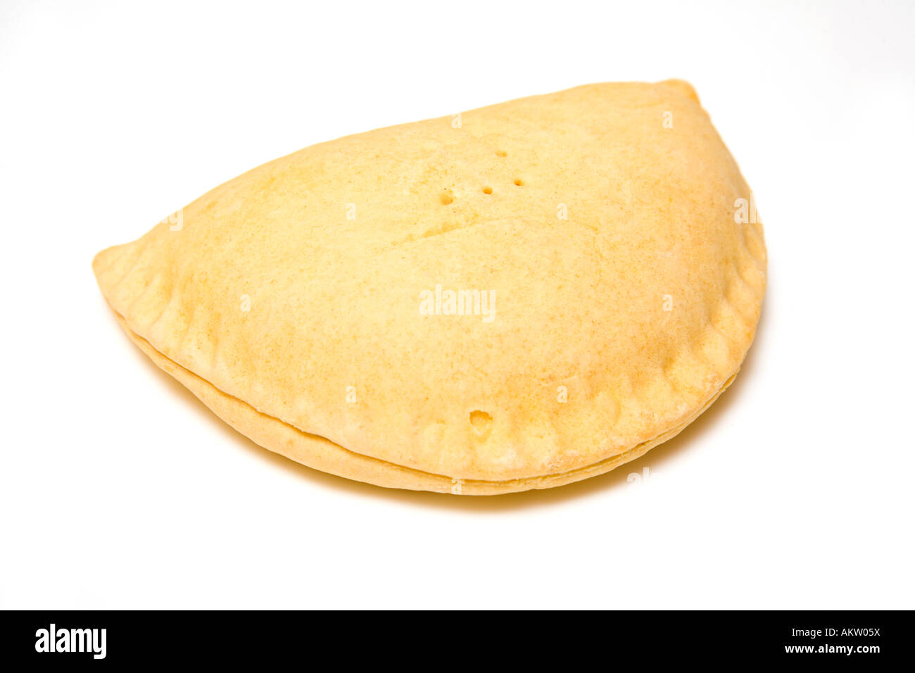 Jamaican meat pattie isolated on a white studio background. Stock Photo