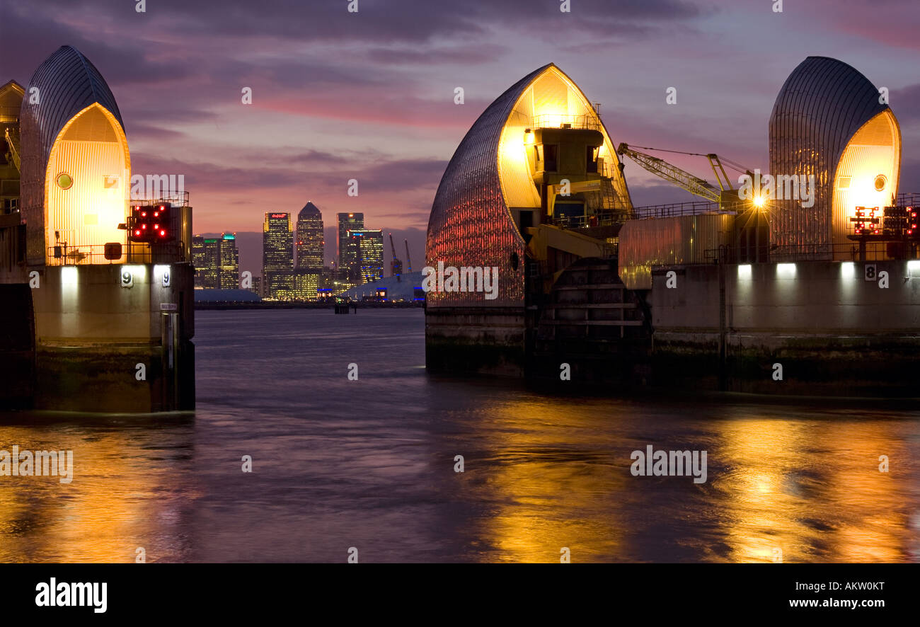 Thames Barrier at night with Canary Wharf in the Background Stock Photo ...