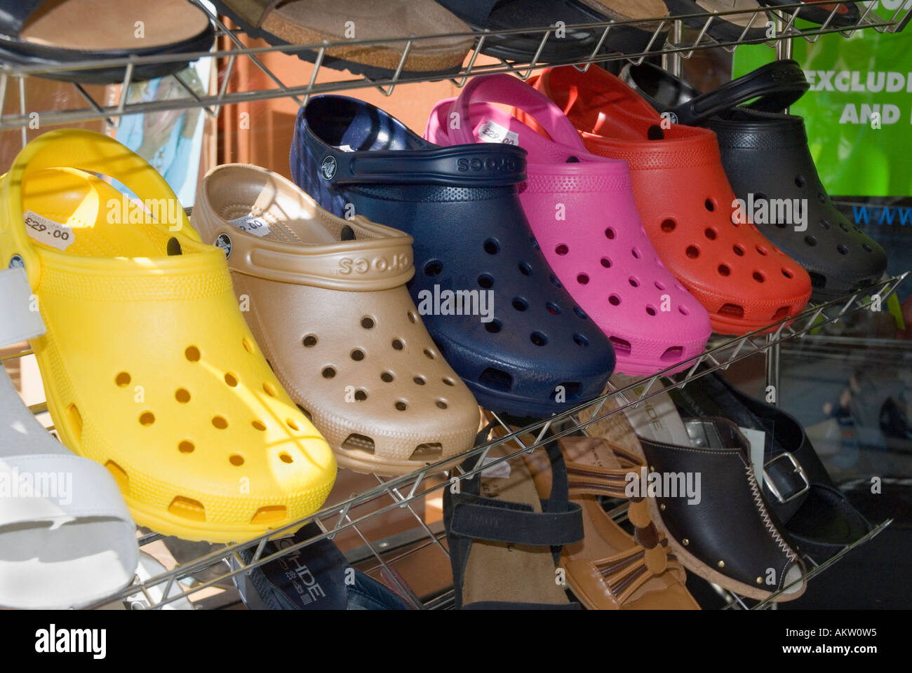 Crocs sandals for sale in a shoe shop Stock Photo - Alamy