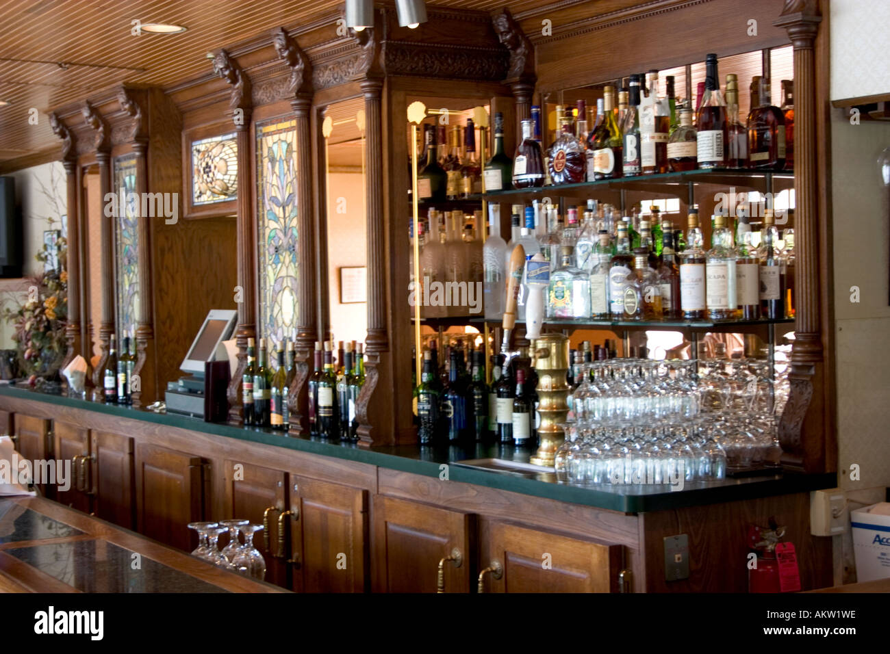Elegant cherry wood bar in the historic Nicollet Island Inn. Minneapolis Minnesota MN USA Stock