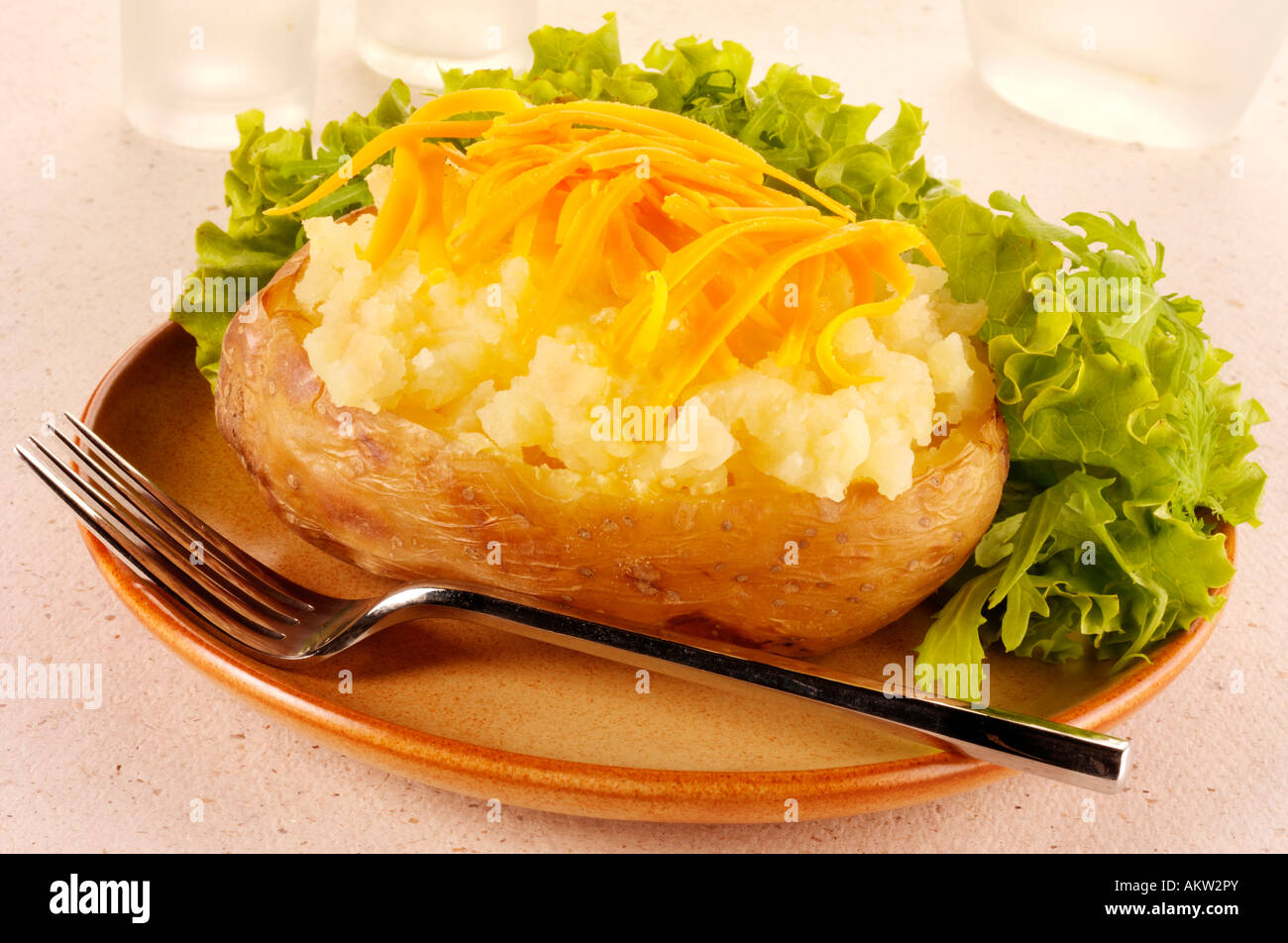 BAKED POTATO WITH CHEESE Stock Photo - Alamy