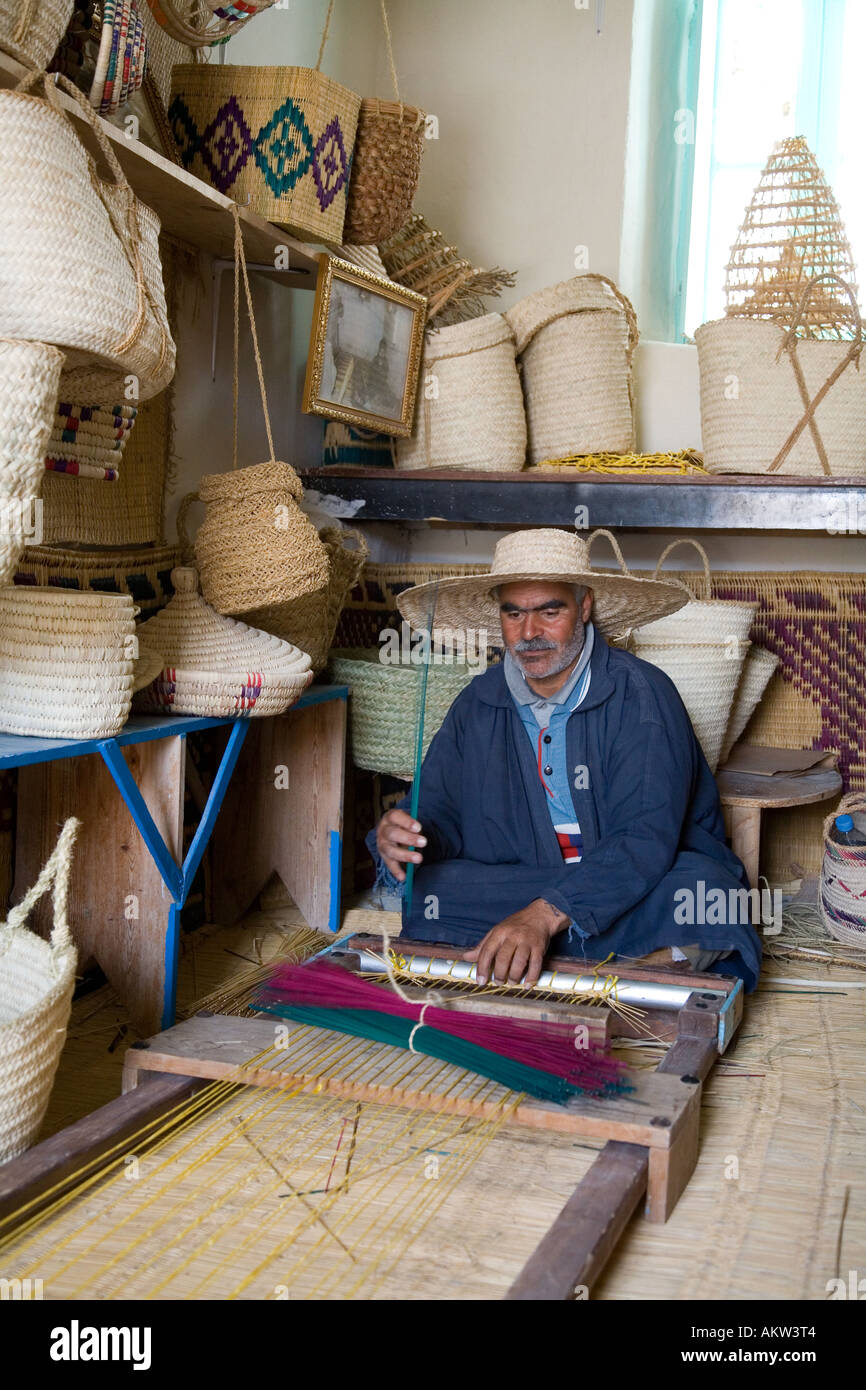 Man in atelier making wickerwork Djerba Tunisia Stock Photo