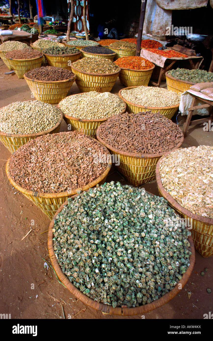 Roiund straw baskets of spices and seasonings seen in an outdoor market Stock Photo