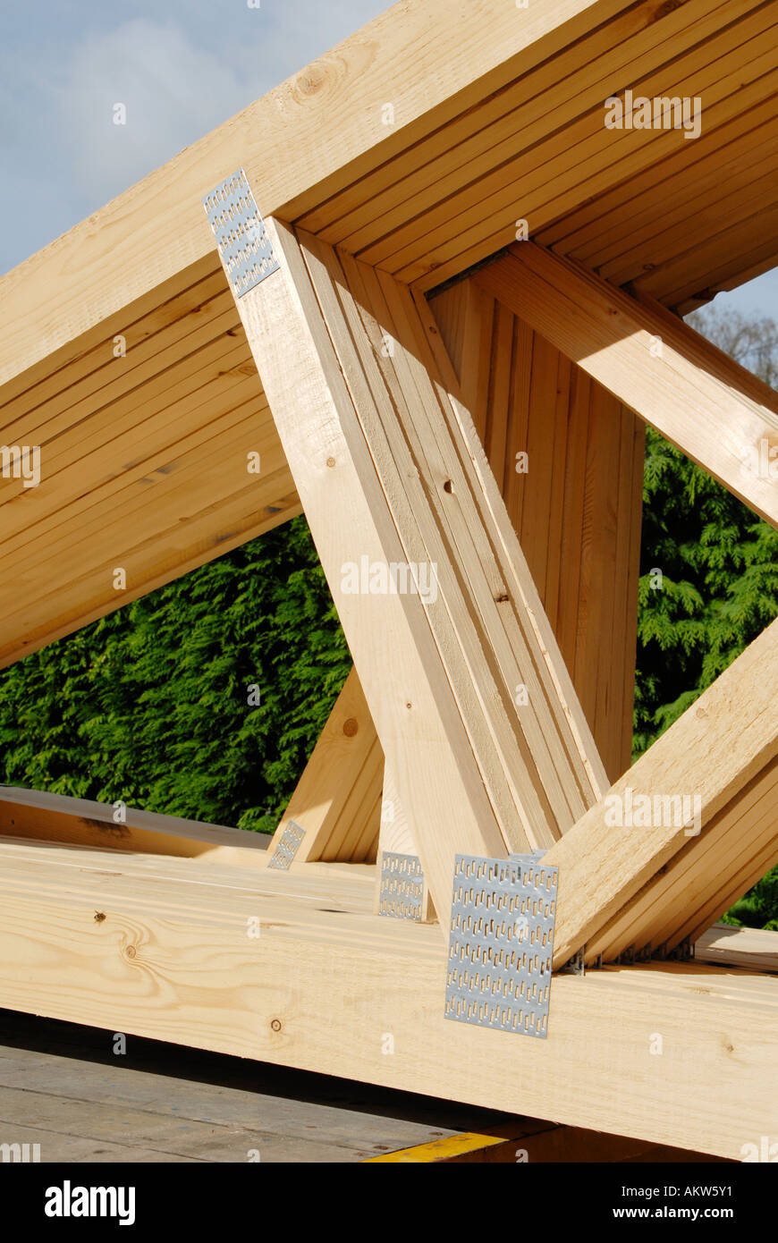 Timber roof joists ready for use on a construction site. England UK. Stock Photo