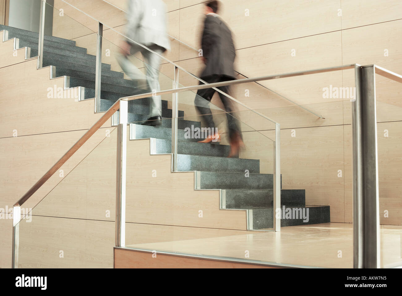 Businessmen Climbing Stairs Stock Photo - Alamy