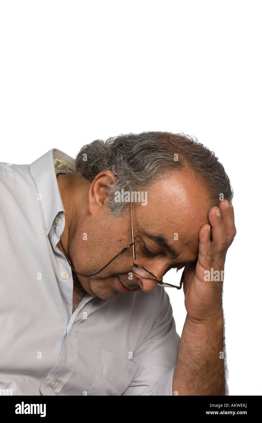 Depressed mature man head in hand Stock Photo