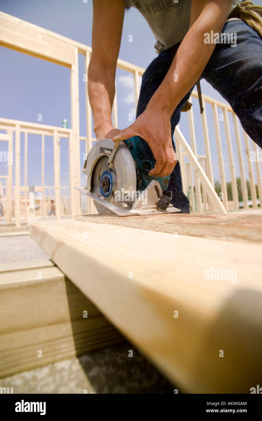 Contractor Cutting with Circular Saw Stock Photo - Alamy