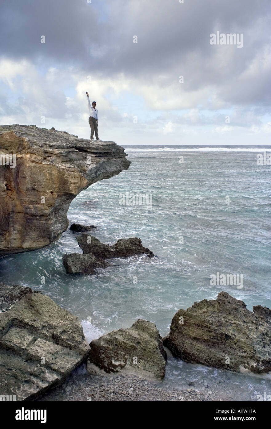 woman standing on cliff top Stock Photo