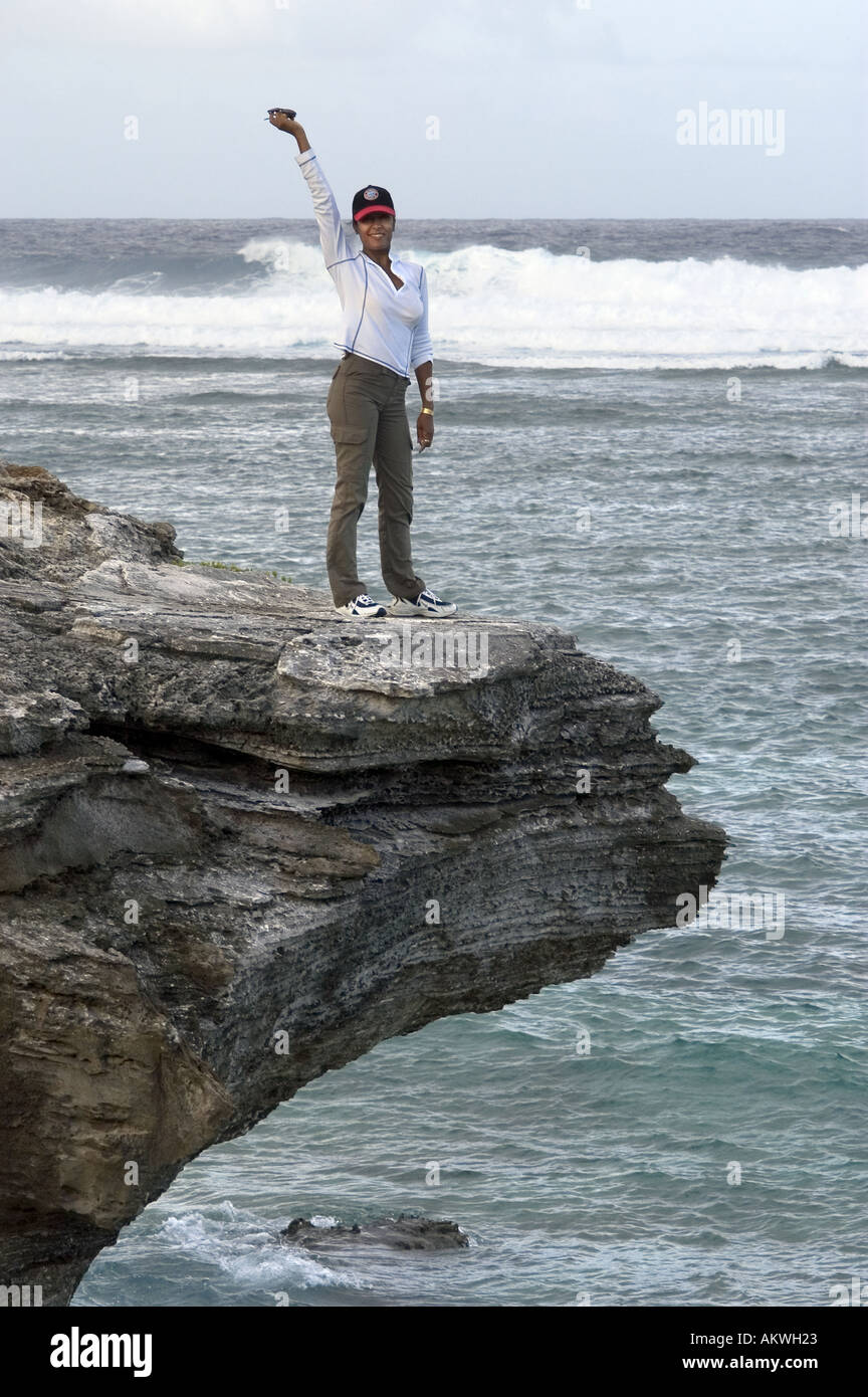 woman standing on cliff top Stock Photo