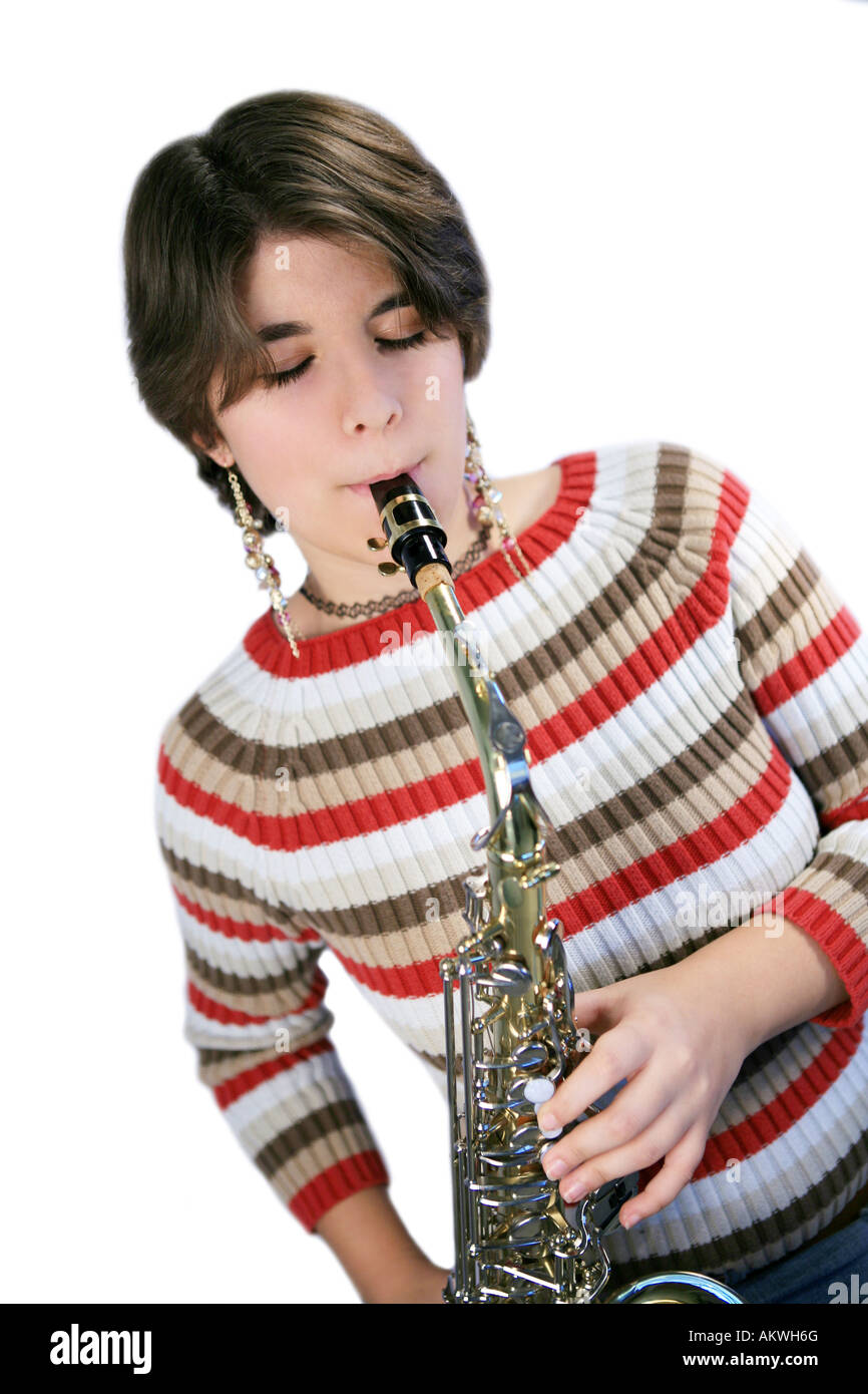 Teenage girl playing alto saxophone Stock Photo