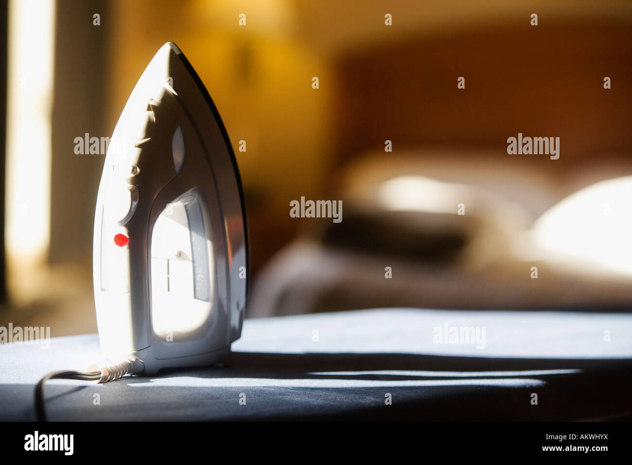 An iron and ironing board Stock Photo Alamy