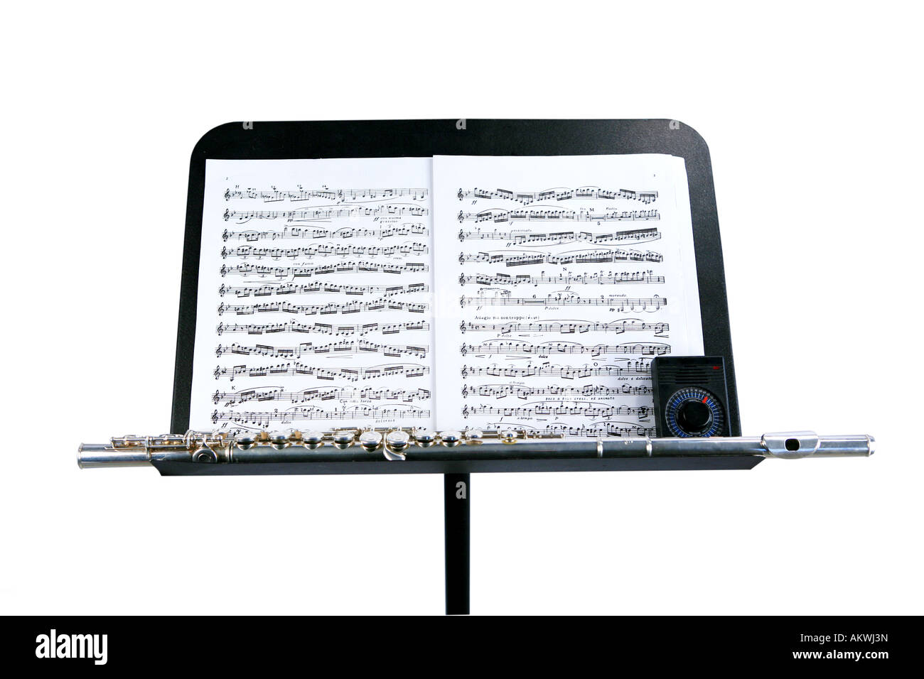 Flute and metronome on music stand with sheet music Stock Photo Alamy