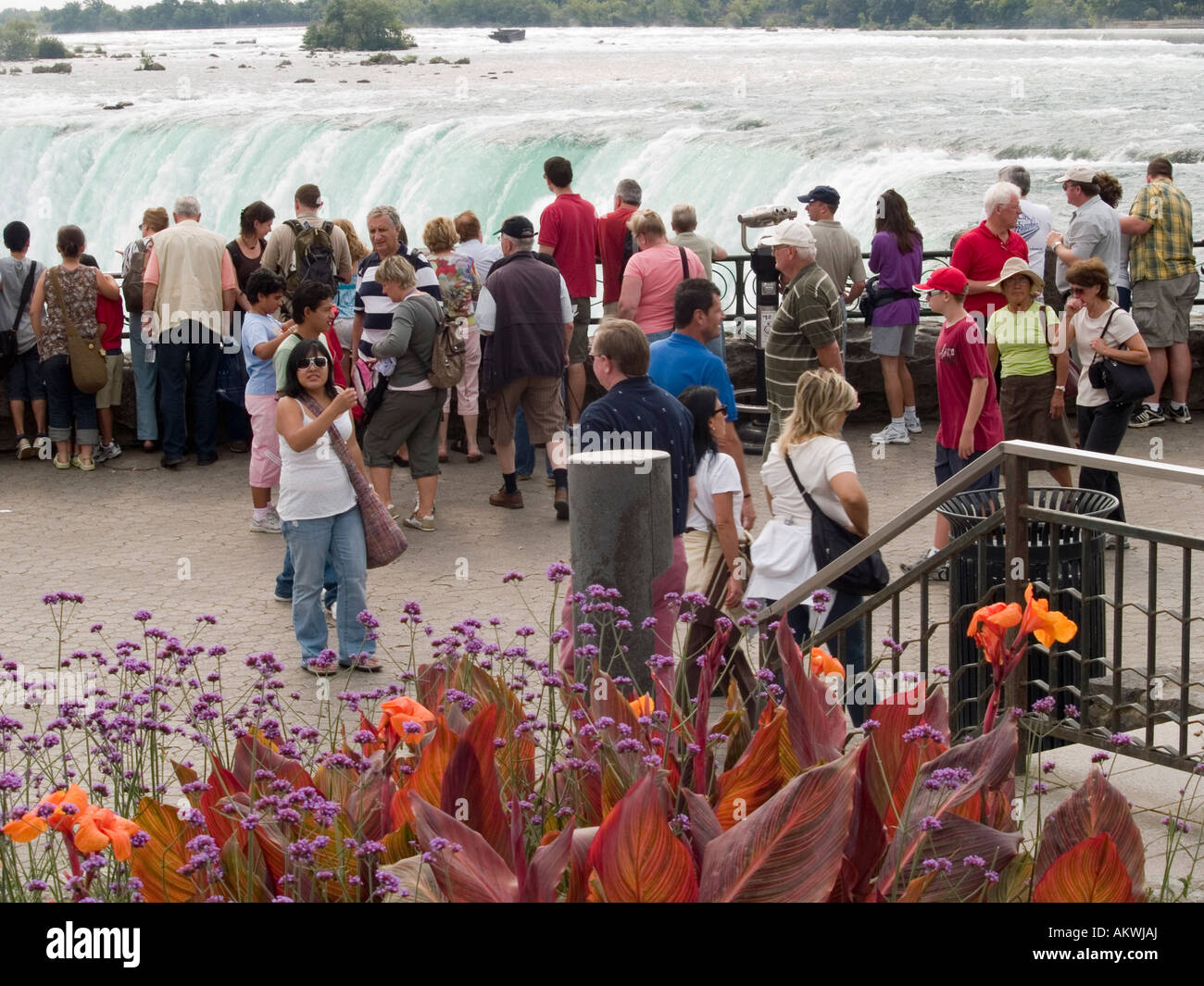 Lots of tourists looking over the railing to the Horseshoe Falls at ...