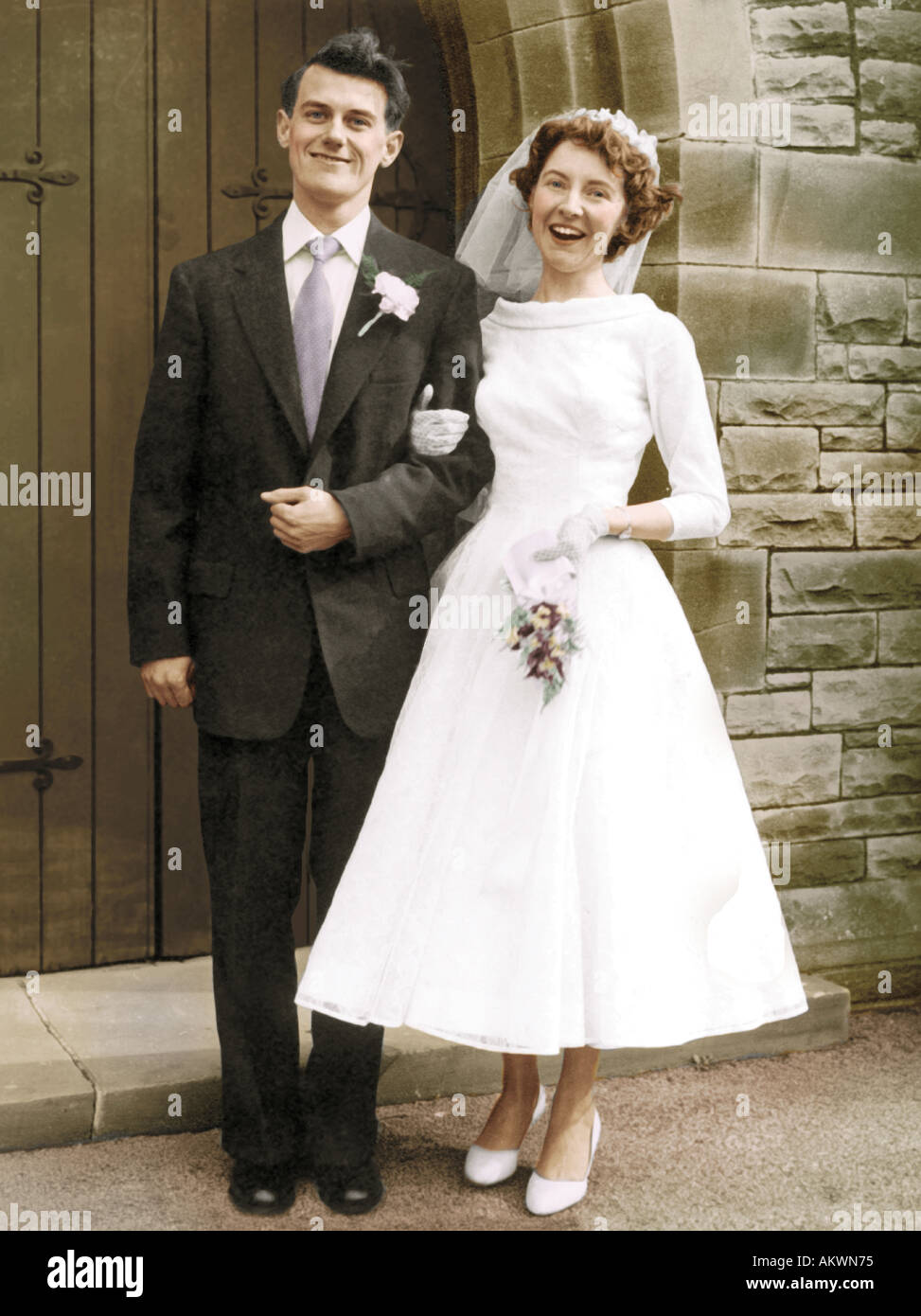 young couple 1960's getting married black and white hand coloured picture Stock Photo