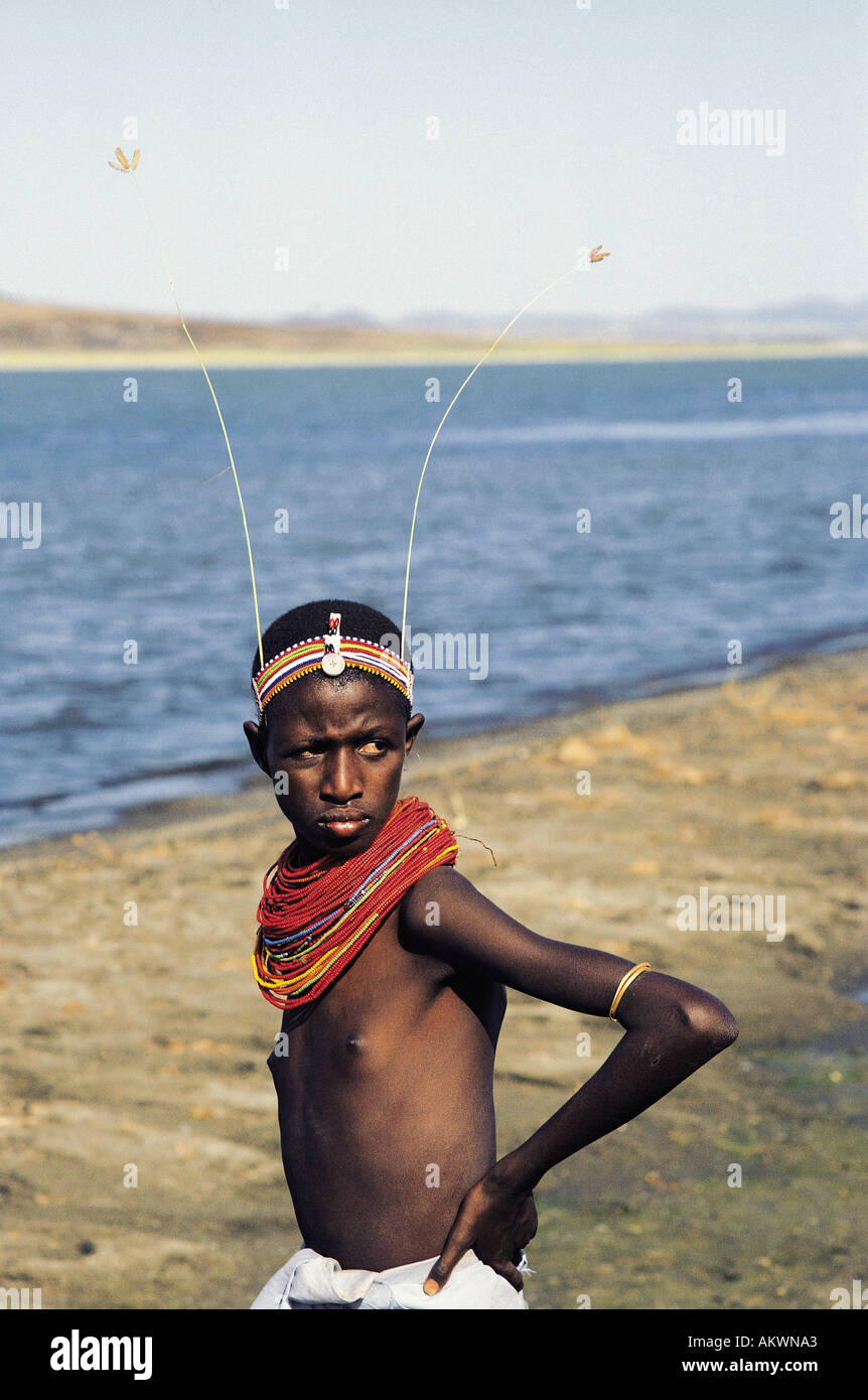 Young El Molo girl or teenager wearing traditional coloured beads and headbands similar to Samburu people Stock Photo