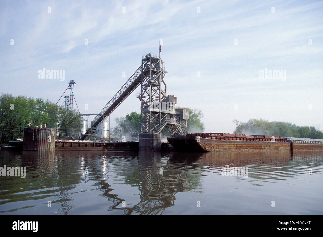 Grain loading facility and barges along the Illinois River In Illinois