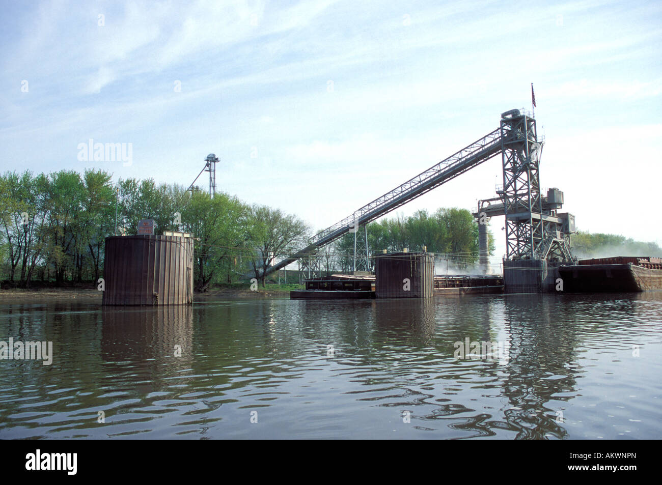 Grain loading facility and barges along the Illinois River In Illinois