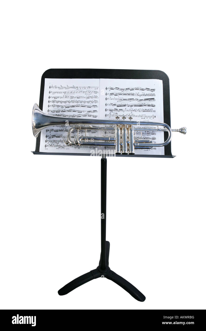 Trumpet on music stand with sheet music isolated on white Stock Photo