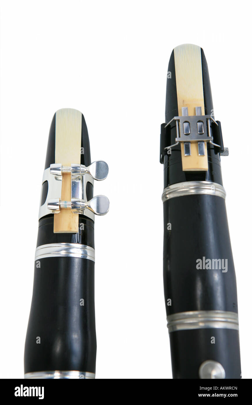 Two clarinets showing reeds and ligature isolated on white Stock Photo