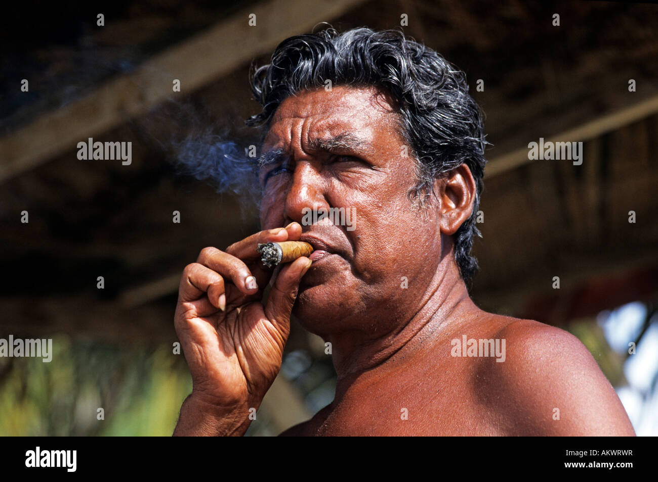 Venezuela, Nueva Esparta State, Margarita Island, Pampatar, portrait of a  man with cigar Stock Photo