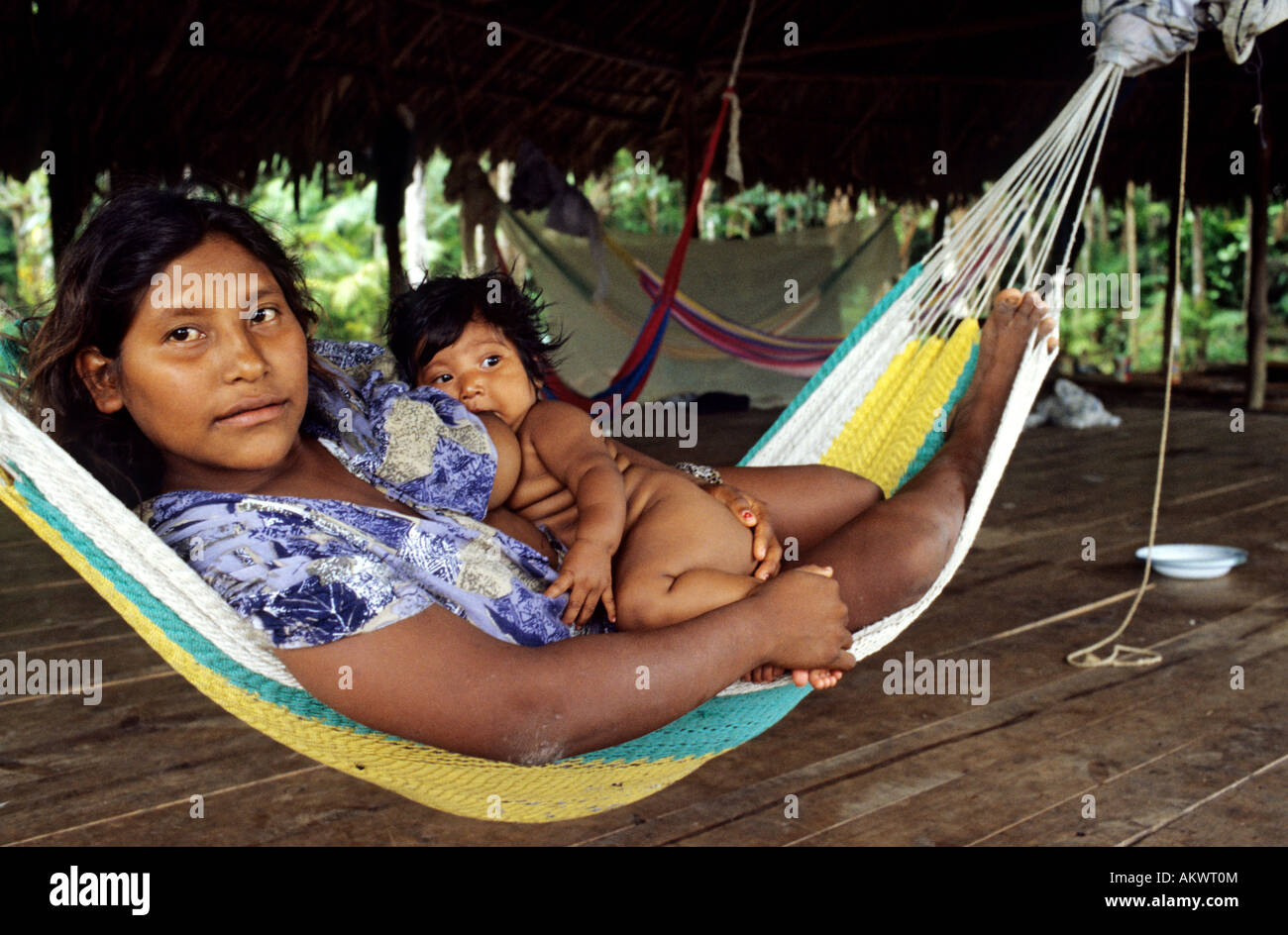 Venezuela, delta of Orinoco River, Manamo River, Warao Indian breastfeeding her baby Stock Photo