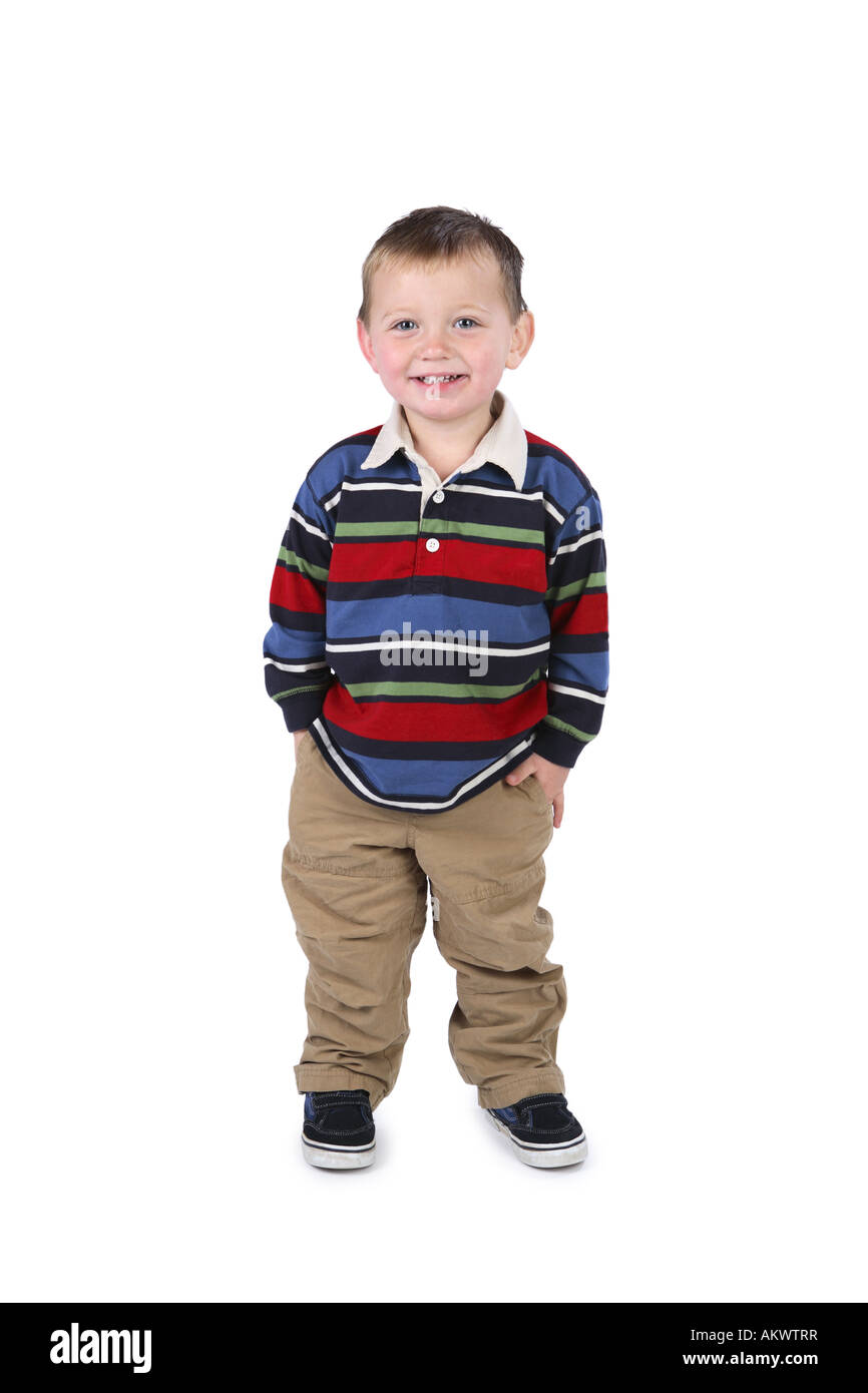 Two year old boy standing cut out on white background Stock Photo