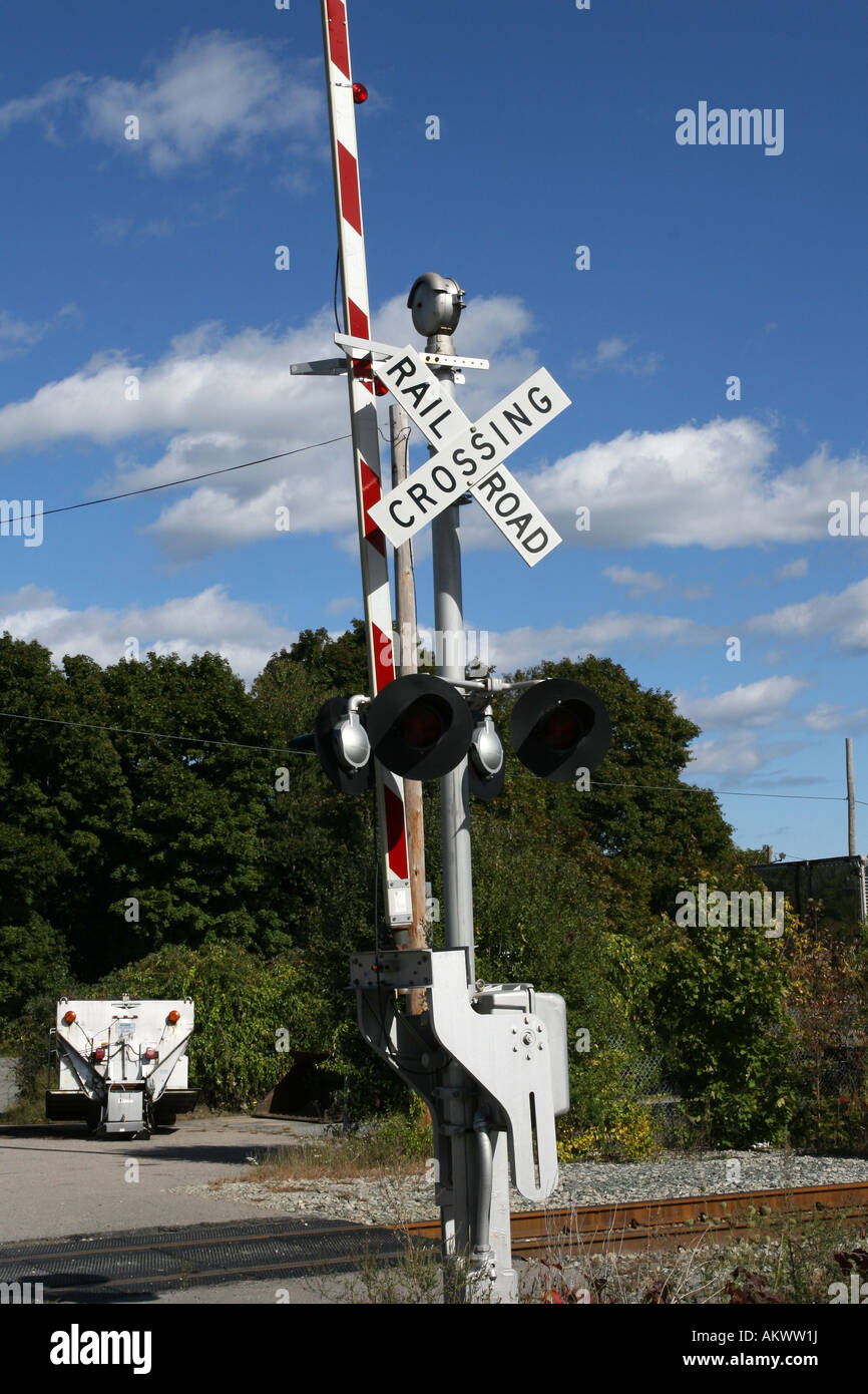 Railroad Grade Crossing Sign and barrier USA Stock Photo