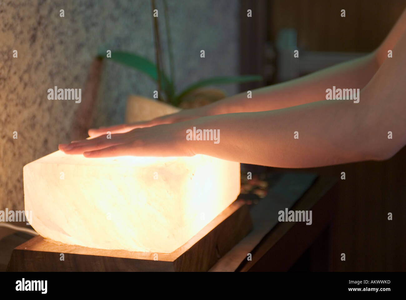 Close Up Of Asian Girls Hands On Glowing Electric Energy Stone Meditating In Spa Taipei Taiwan China Stock Photo