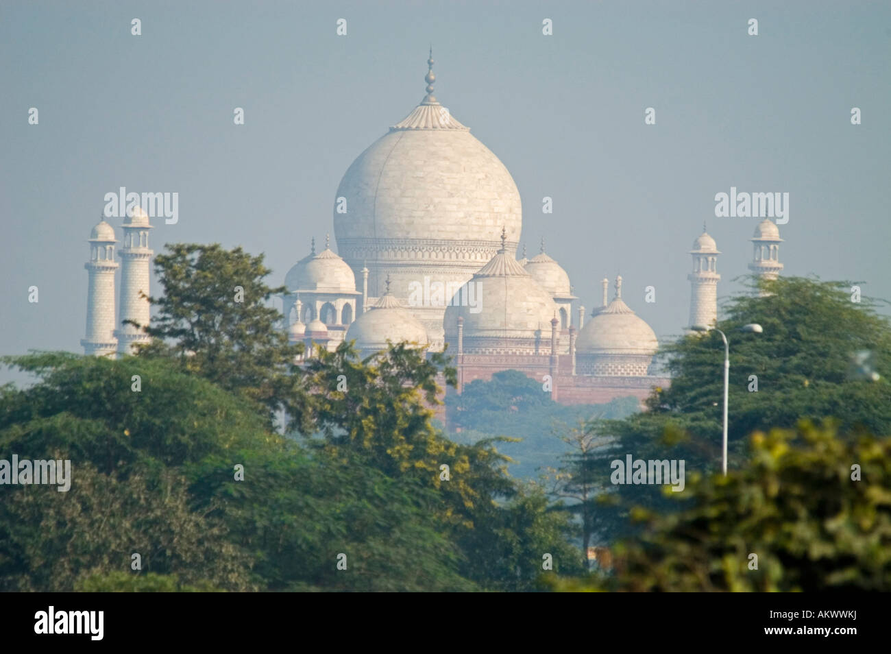 The Taj Mahal rises out of the plains of Uttar Pradesh as viewed from Agra's Red Fort in Agra, Uttar Pradesh, - Stock Image