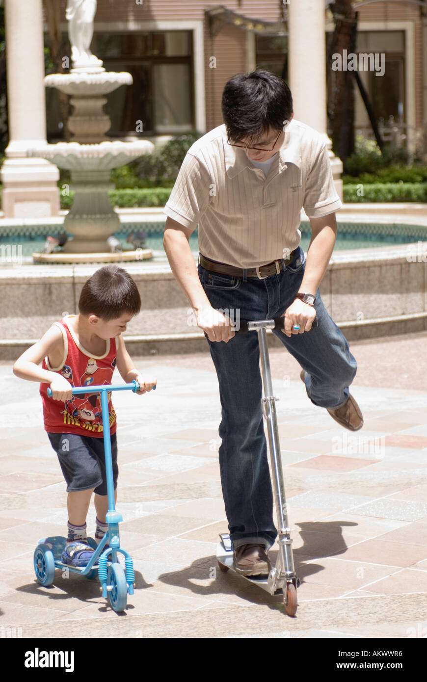 Asian Father Teaching Son To Ride A Scooter Taiwan China Stock Photo