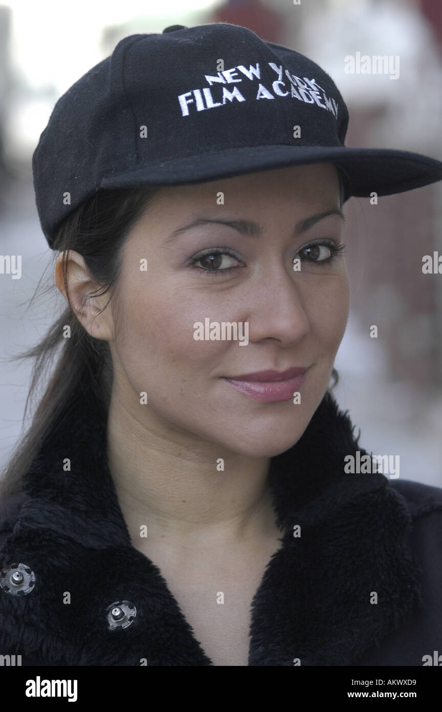 A portrait of a Asian woman wearing a baseball cap Stock Photo - Alamy