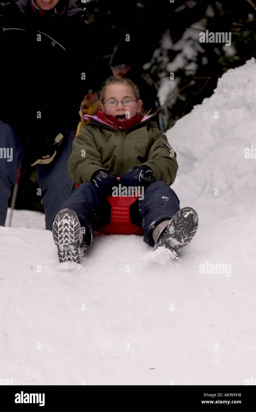 sledding girl Stock Photo