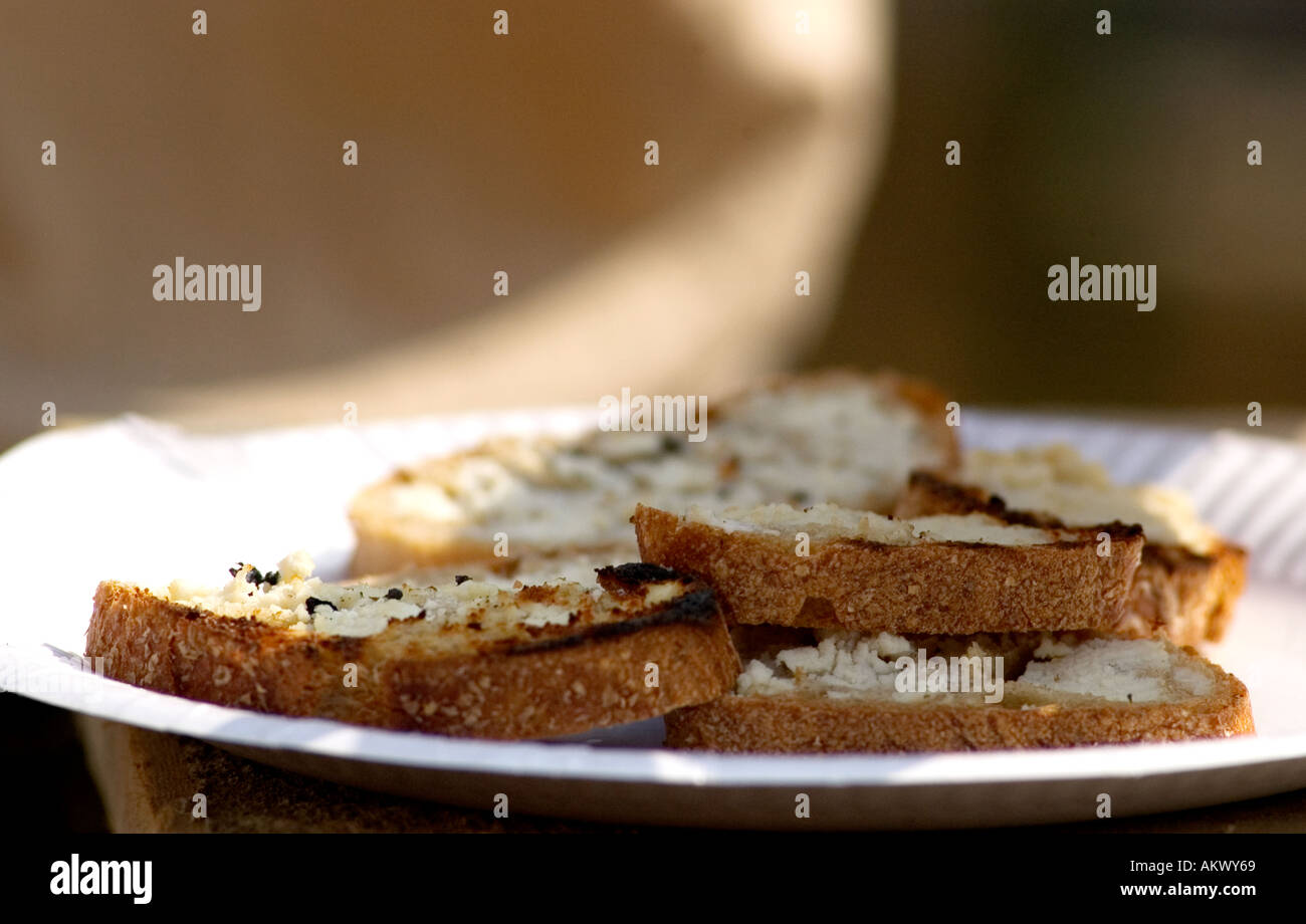 slice of fresh baked bread with cheddar soft cheese Stock Photo