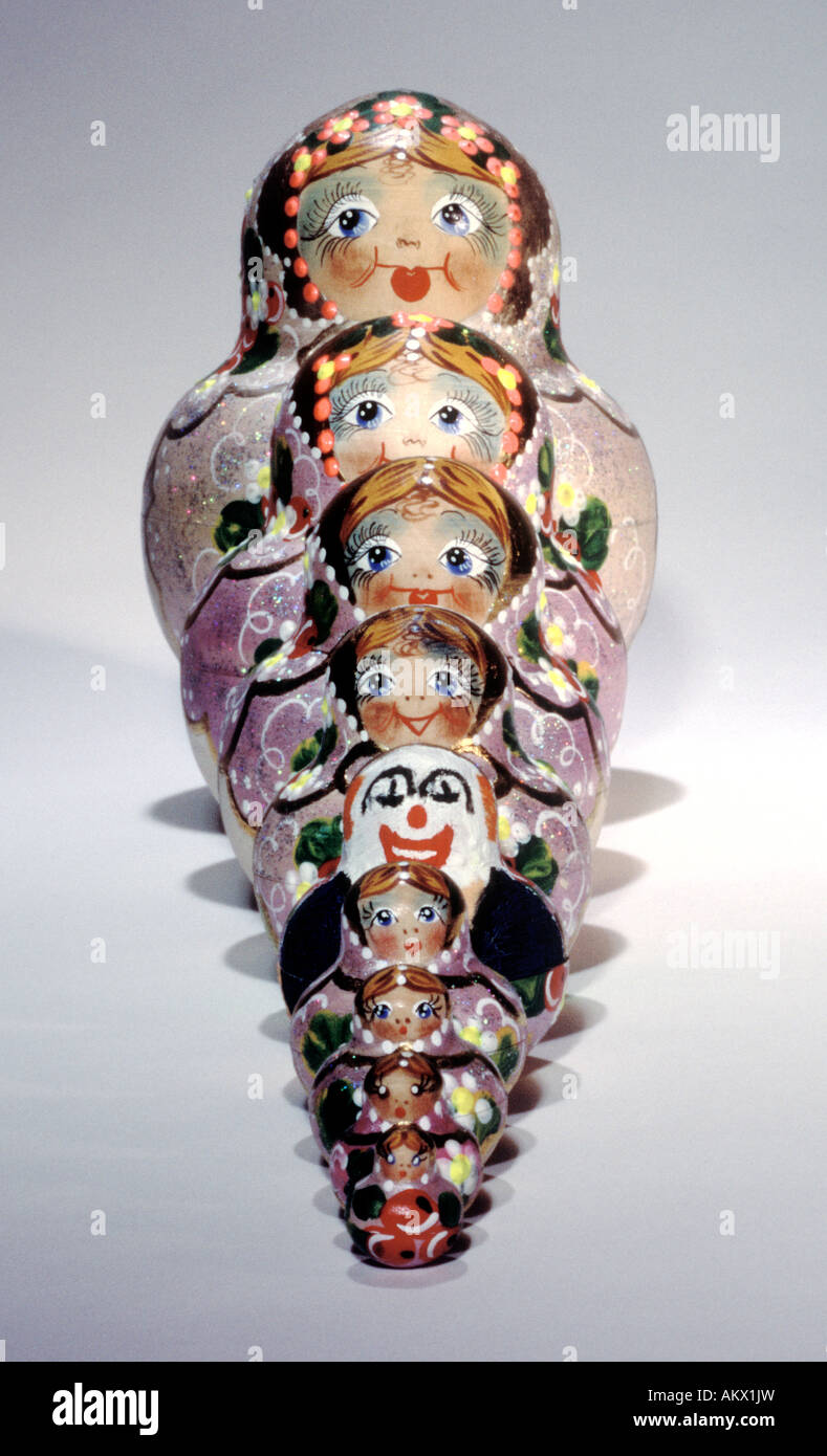 Russian Dolls with a Deviant. Straight line, white background Stock Photo